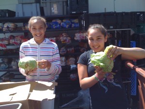 Handing out produce at the Food Bank.