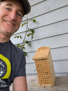 Speaker Michael with one of his mason bee houses.